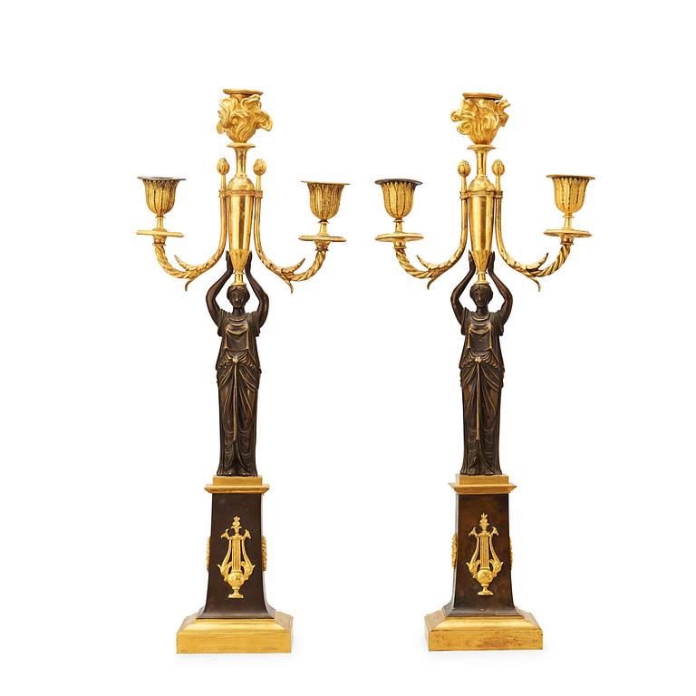 A pair of  Empire early 19th century three-light candelabra.