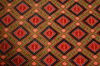 A wall textile, signed, around the year 1900, 208 x 130 cm.