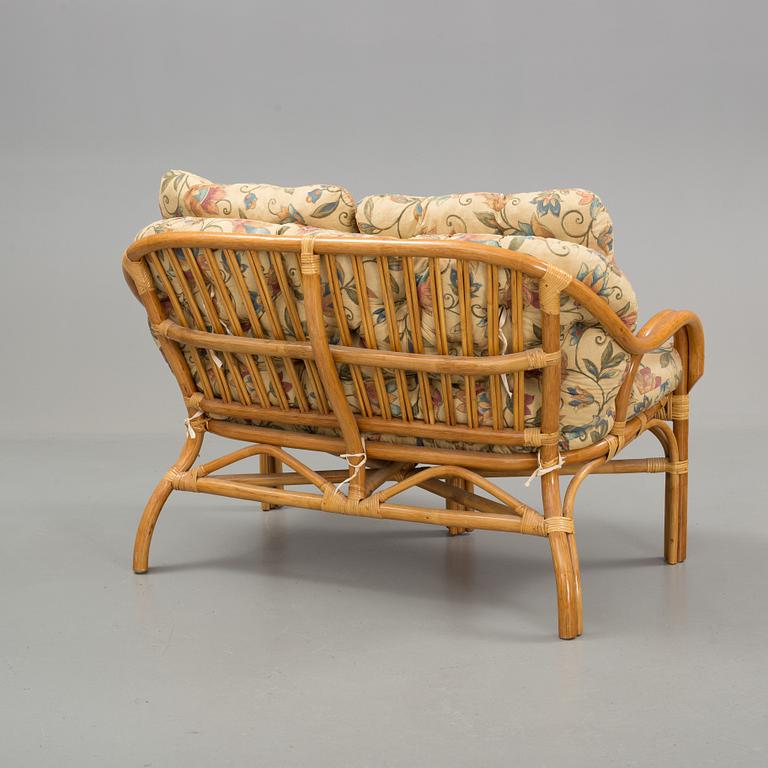 A set of sofa, easy chairs and table in four parts, late 20th century.