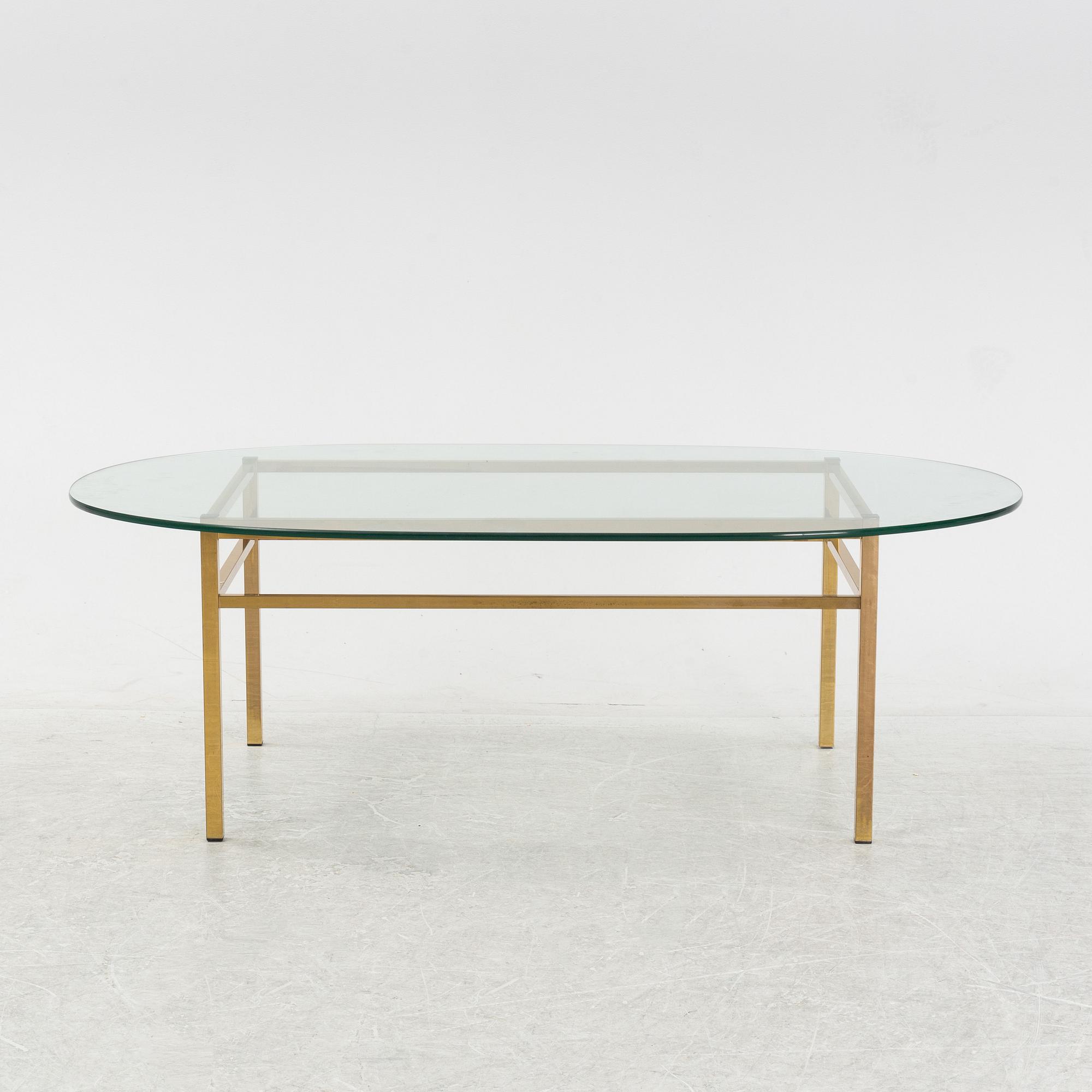 A glass and brass coffee table, Engelsson, Sweden, 21st century.