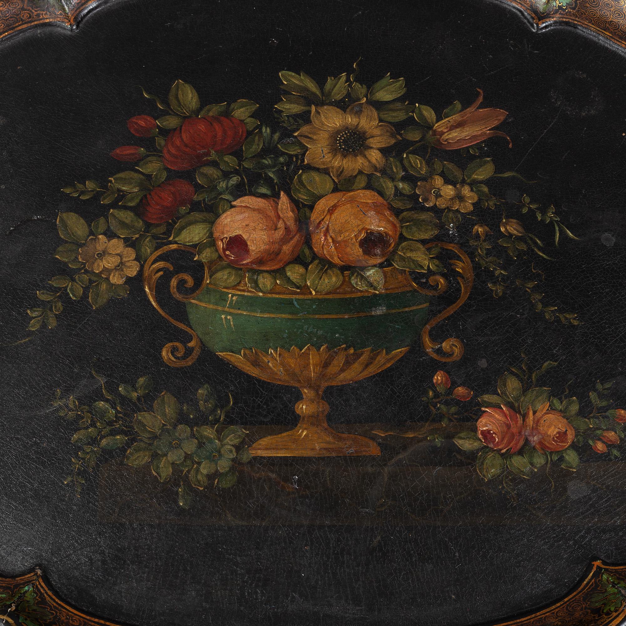 A rococo style side table with a loose tray.