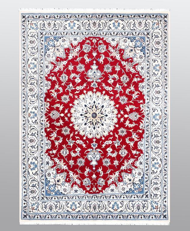 A carpet, Nain, part silk, ca 238 x 170 cm.