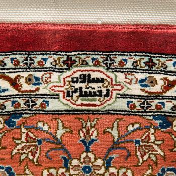 A silk Qum rug, circa 152 x 101 cm.