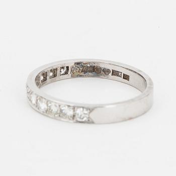 Brilliant-cut diamond half-eternity ring.