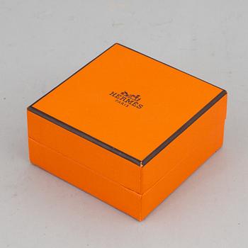HERMÈS, a 'Clic H' bangle.