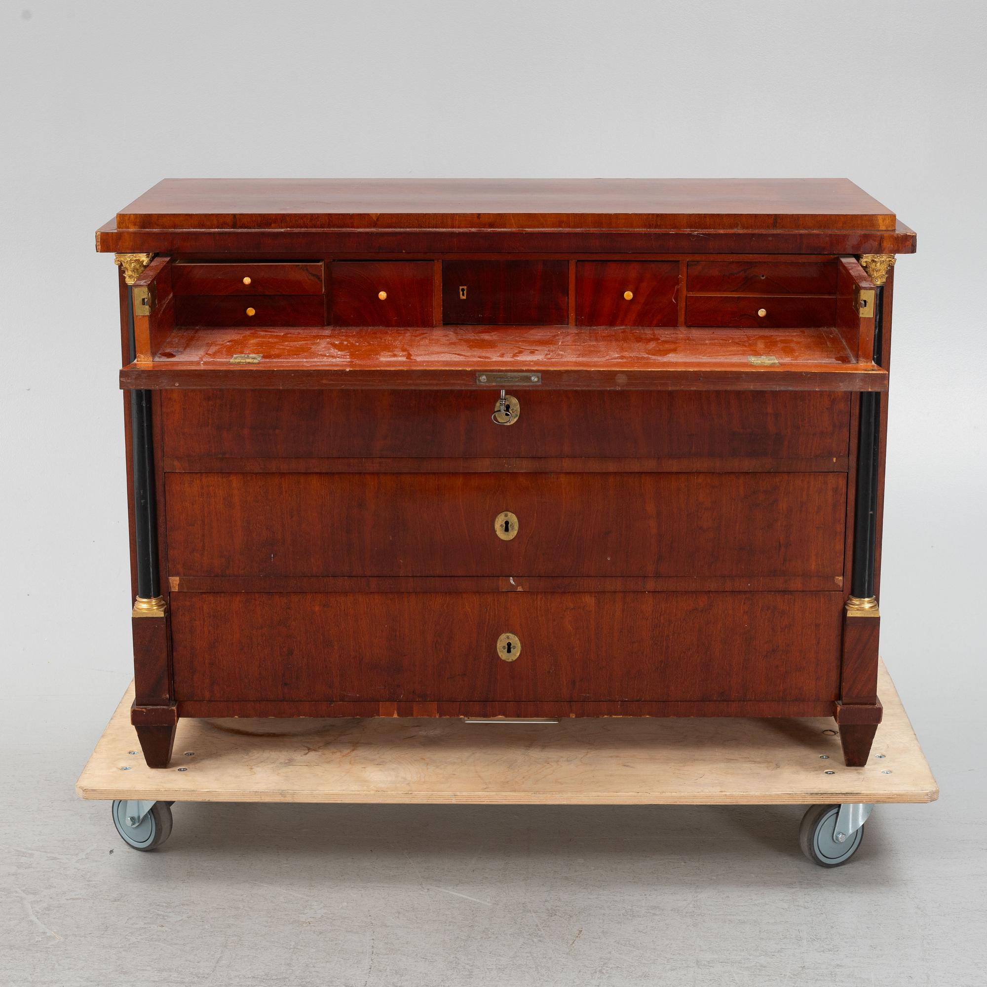 An Empire writing commode, early 19th century.