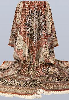An Oriental silk carpet, c. 463 x 306 cm.