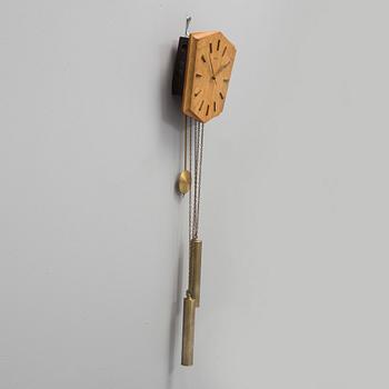 An oak veneered wall clock from the 1960s.