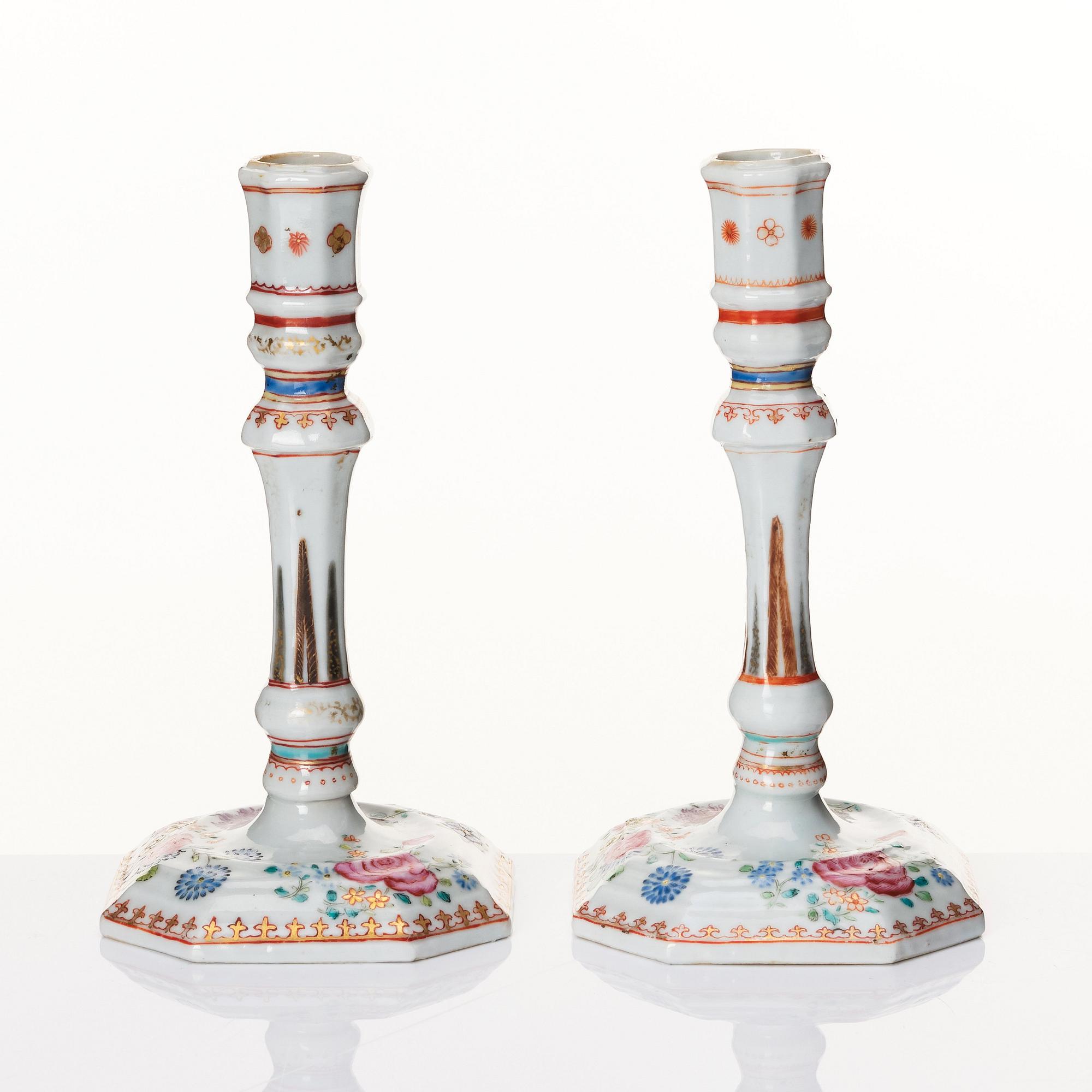 A pair of famille rose candles sticks, Qing dynasty, Qianlong (1736-95).
