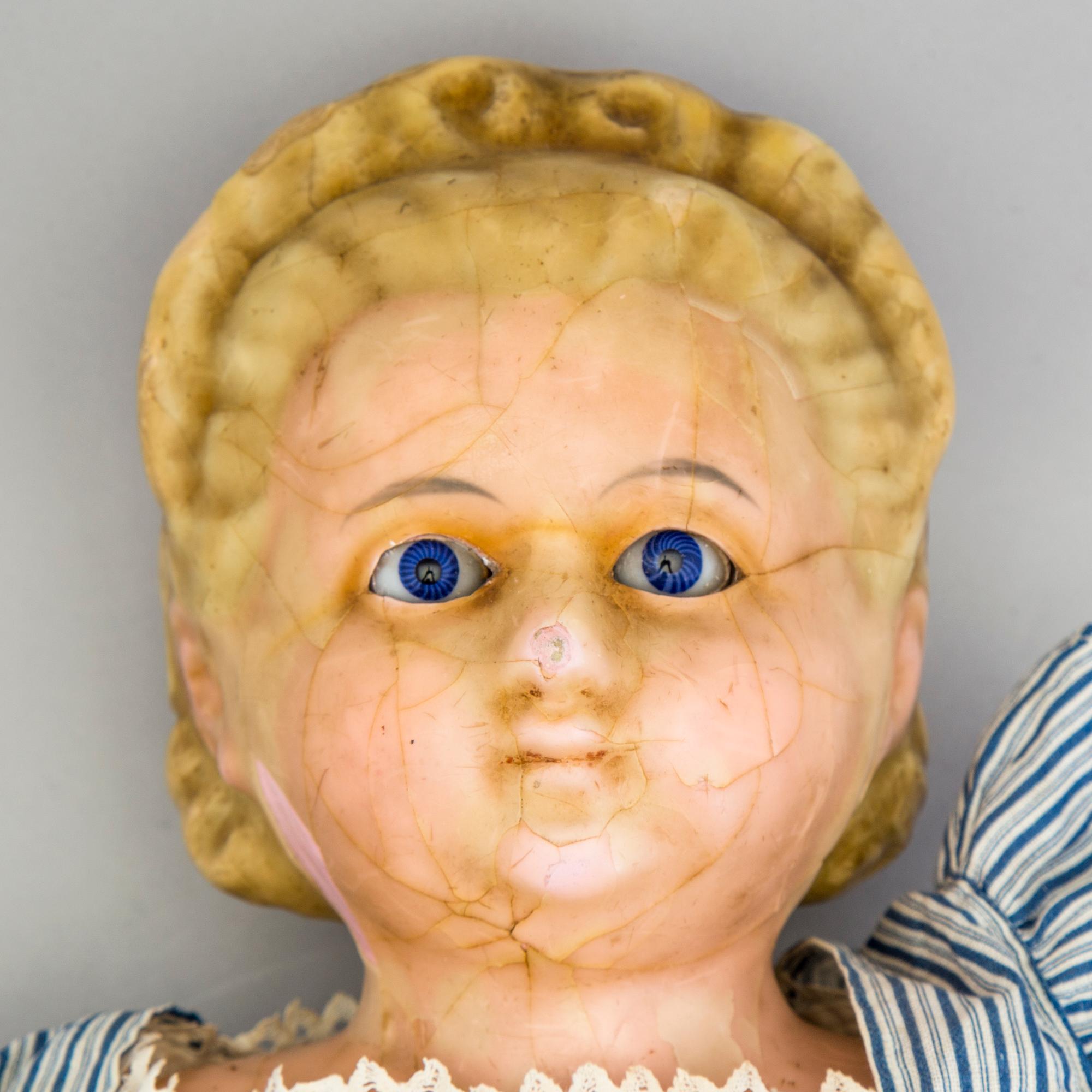 A Wax over papier Mache doll. "Alice in Wonderland". Second half of the 19th century.