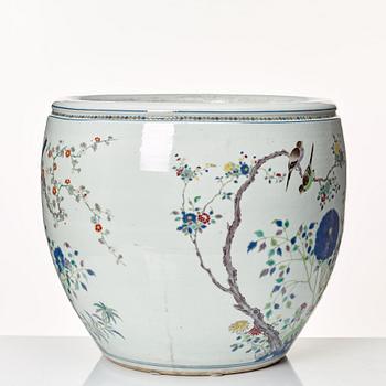 A large famille rose fish bowl, late Qing dynasty, circa 1900.