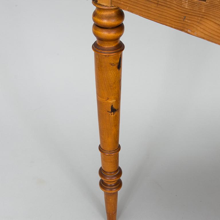 A birch veneered dining table, second half of the 19th Century.