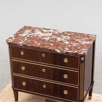 a 20th century gustavian style chest of drawer.