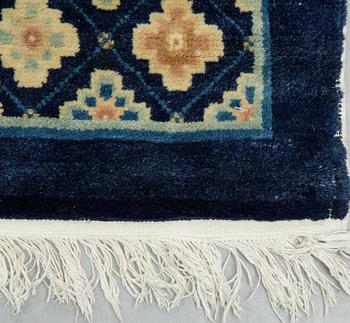A carpet, semi-antique/Old China, ca 302 x 196 cm.