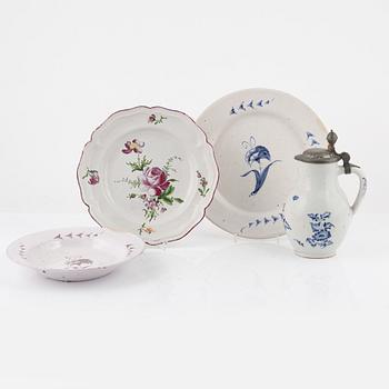 An earthenware dish, tankard and two plates, 18th century.