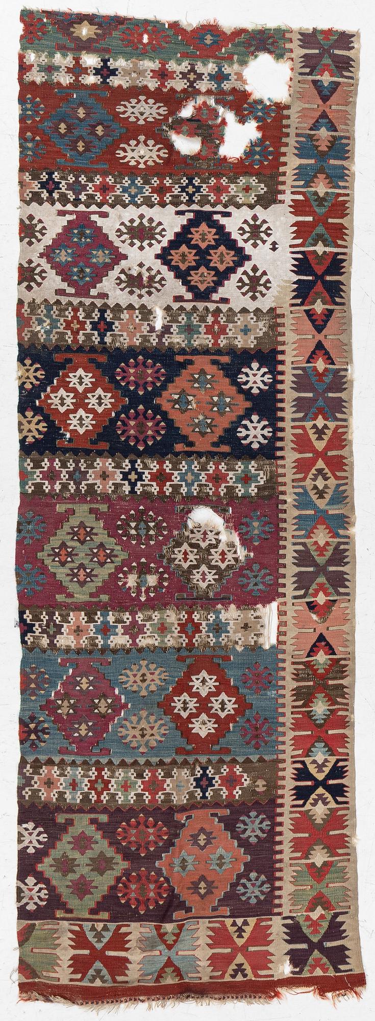 An antique kilim fragment, central Anatolia, c. 238 x 82 cm.