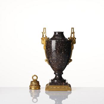 A Swedish 'Gammelklitt'-porhyry urn with cover, Älvdalen, early 19th century.