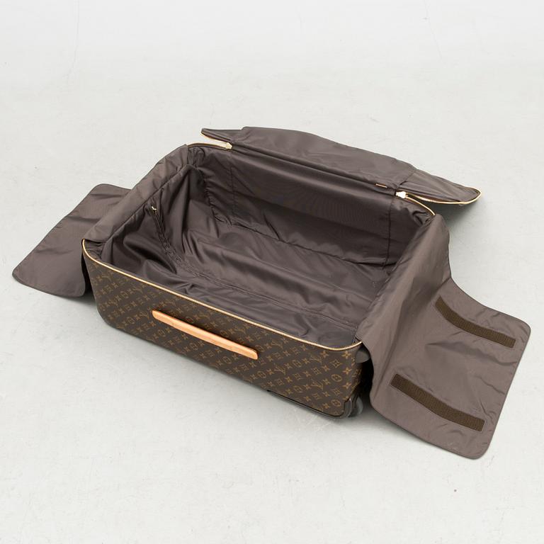 A Monogram Canvas Pégase 65 Suitcase with a Protective Cover.