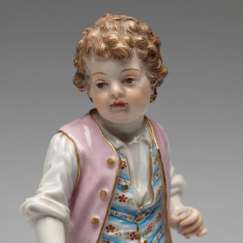 A Meissen figure of a young boy with grapes, 1890's.