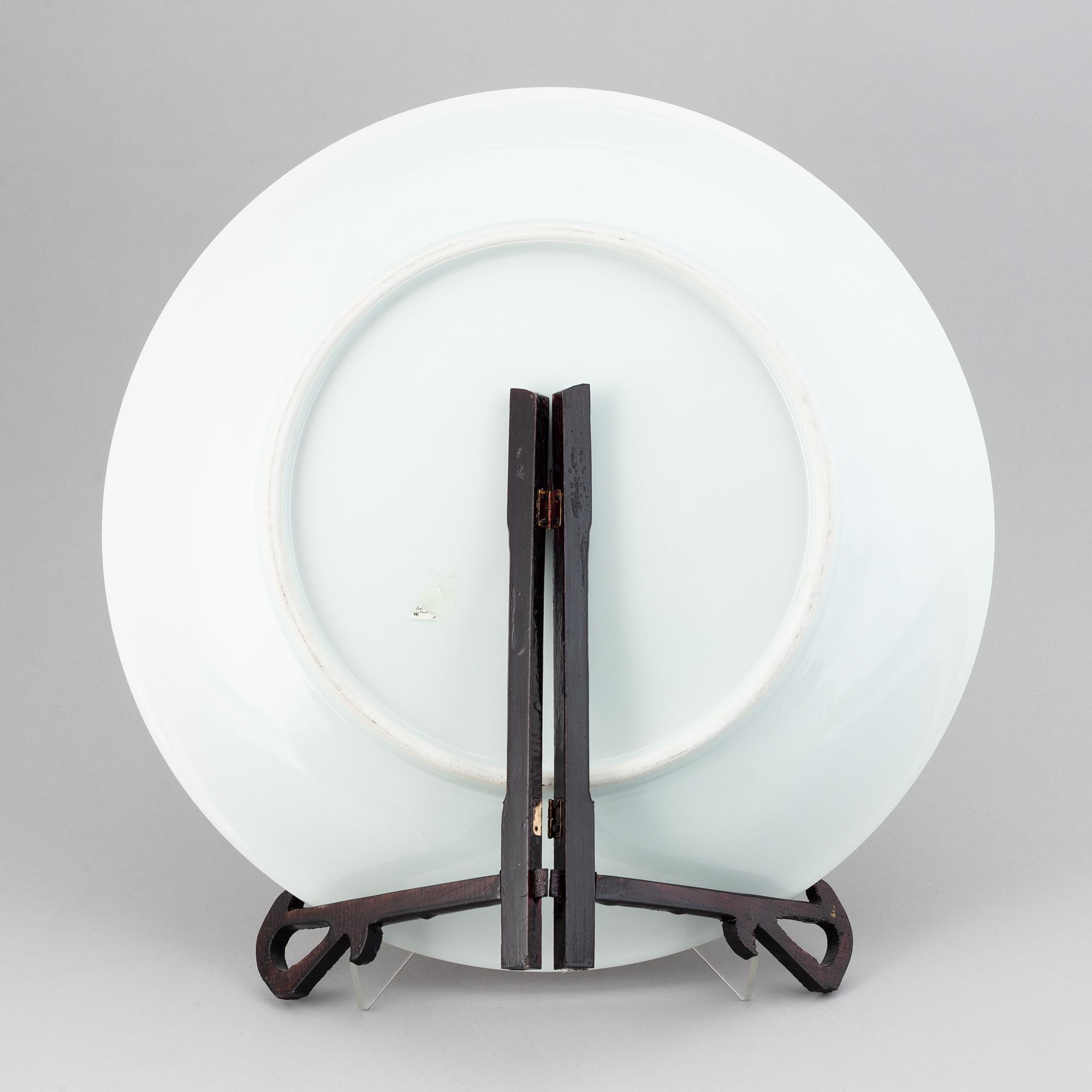 A large Chinese dish with a fierce five clawed dragon, modern.