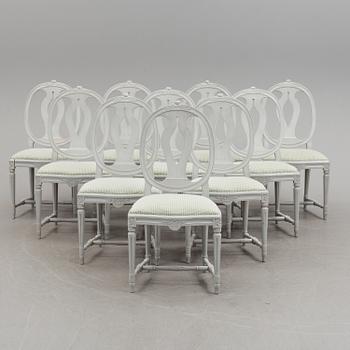 A Gustavian style dining table and ten chairs, 20th century.
