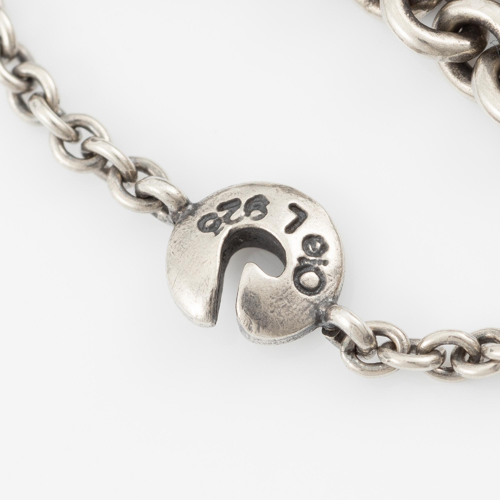 Necklace, Ole Lynggaard, with heart-shaped clasp in 18K gold set with brilliant-cut diamonds, chain in silver with four strands.