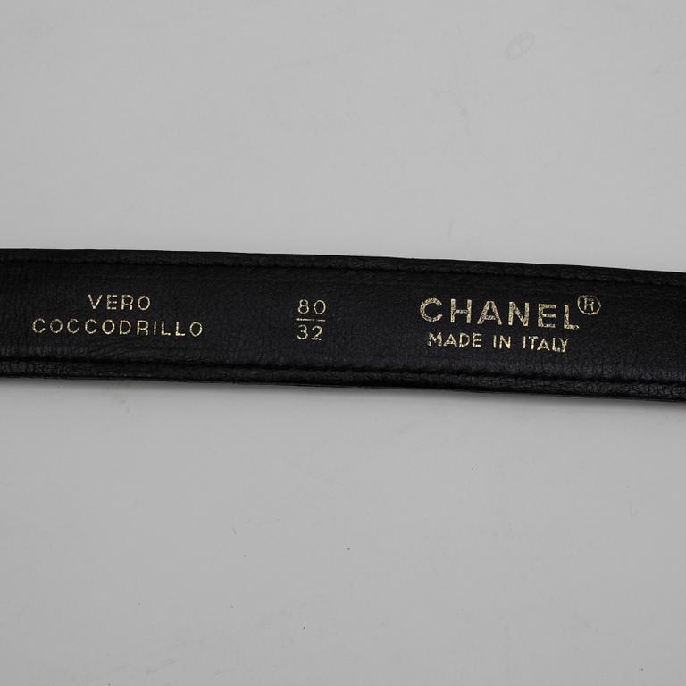 CHANEL, a black crocodile leather belt.