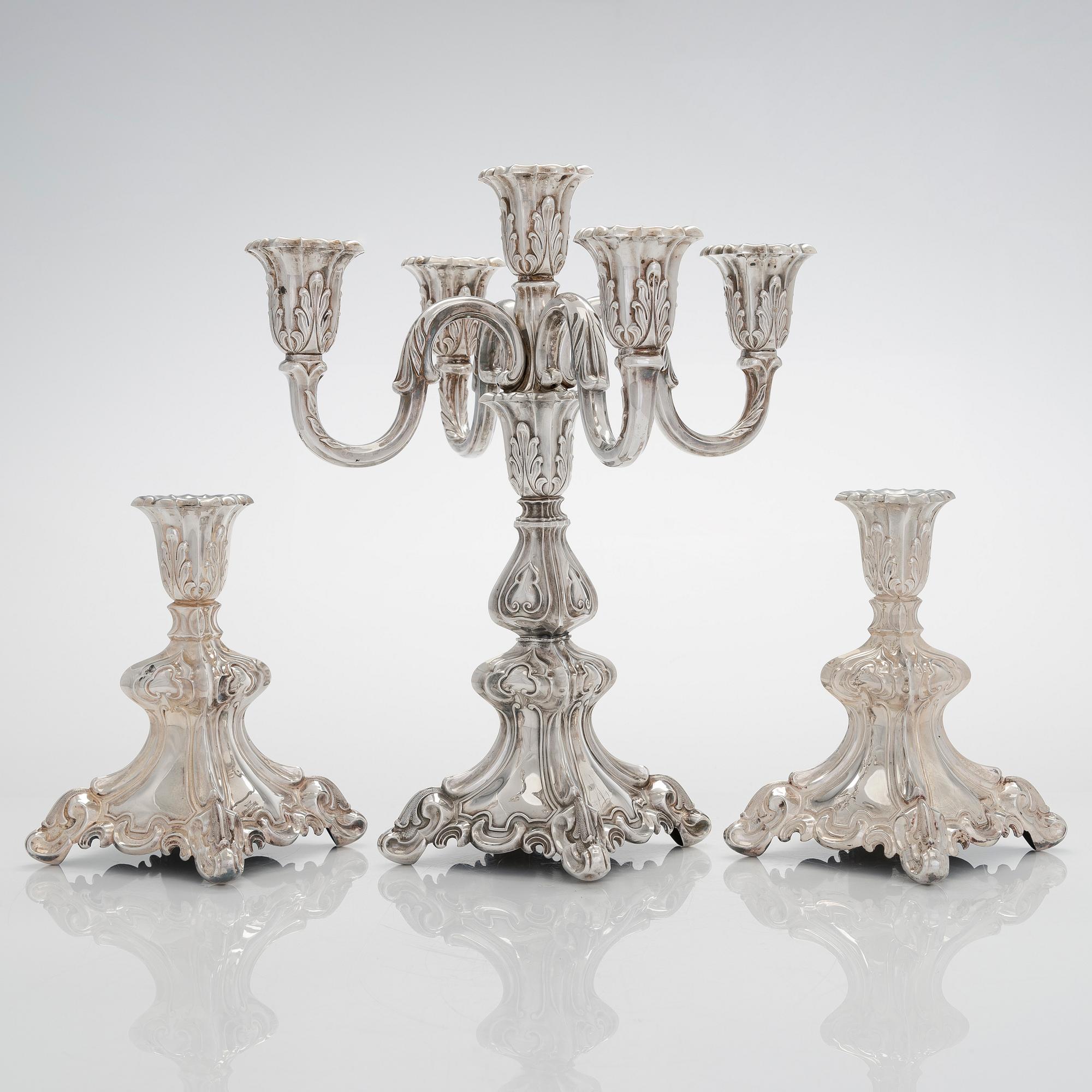A 5-candle silver candelabra and a pair of candlesticks, silver, Auran Kultaseppä, Turku 1984.