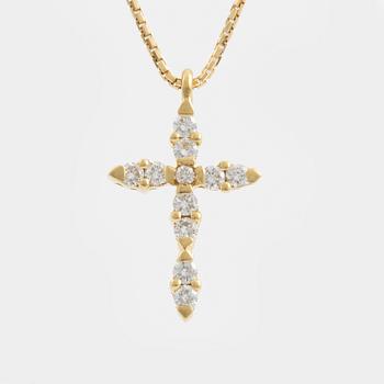 A pendant/cross 18K gold with round brilliant-cut diamonds.