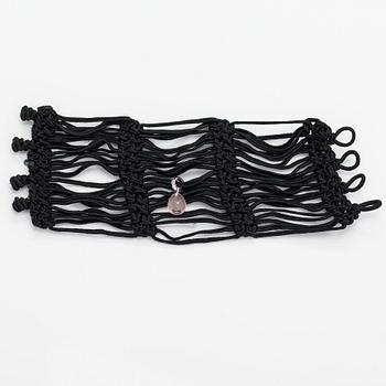 Ole Lynggaard, A satin like band bracelet with an 18K white gold and rose quartz "Sweet drops" pendant.