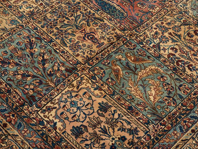 A CARPET. An old Kerman. 521 x 356 cm.