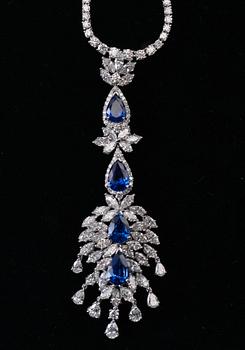 A SET OF JEWELLERY, brilliant- navette- and drop cut diamonds c. 19 ct. Ceylon sapphires c. 15 ct. Weight 49 g.