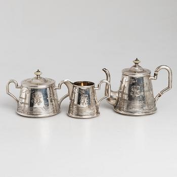 A five-piece Russian parcel-gilt tea set, maker's mark B.A. for Vasili Andrejev or Vasili Akimov, Moscow, 1898-1914.